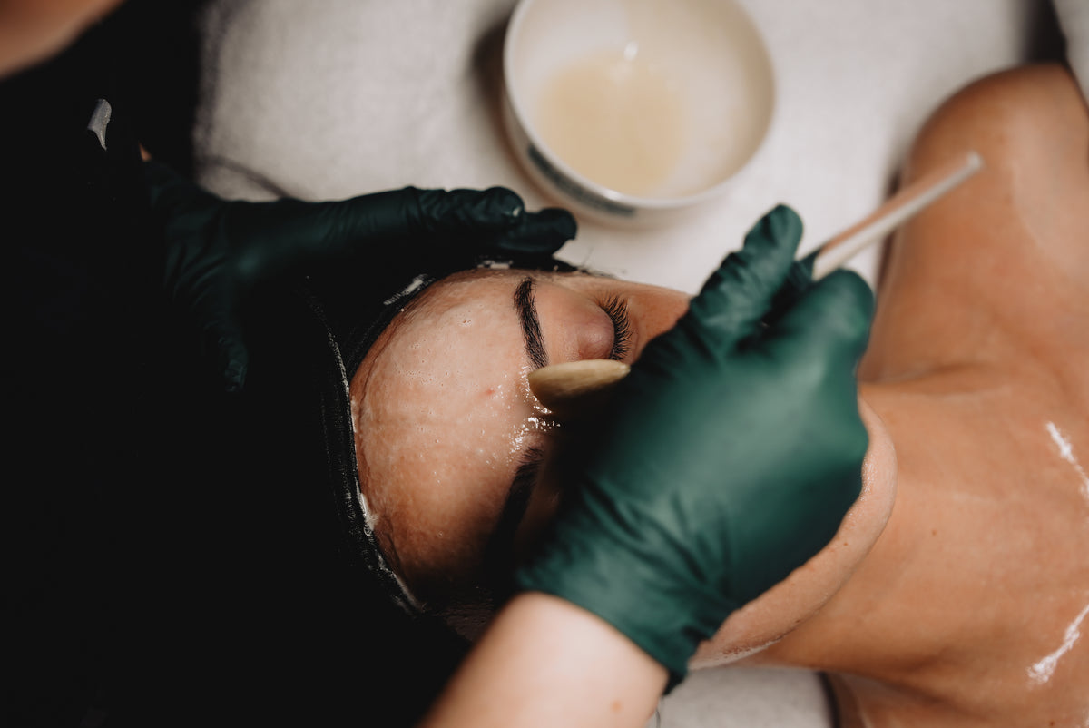 Esthetician applying an advanced cellular skin treatment at Aging Gracefully Skin Experts in Seattle
